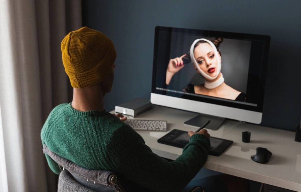 Man working at home editing pictures on computer